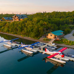 Aerial shot of the Lodge and water with float planes